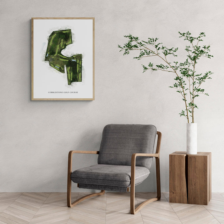 Classic Map of Cobblestone Golf Course with a comfy armchair and large plant