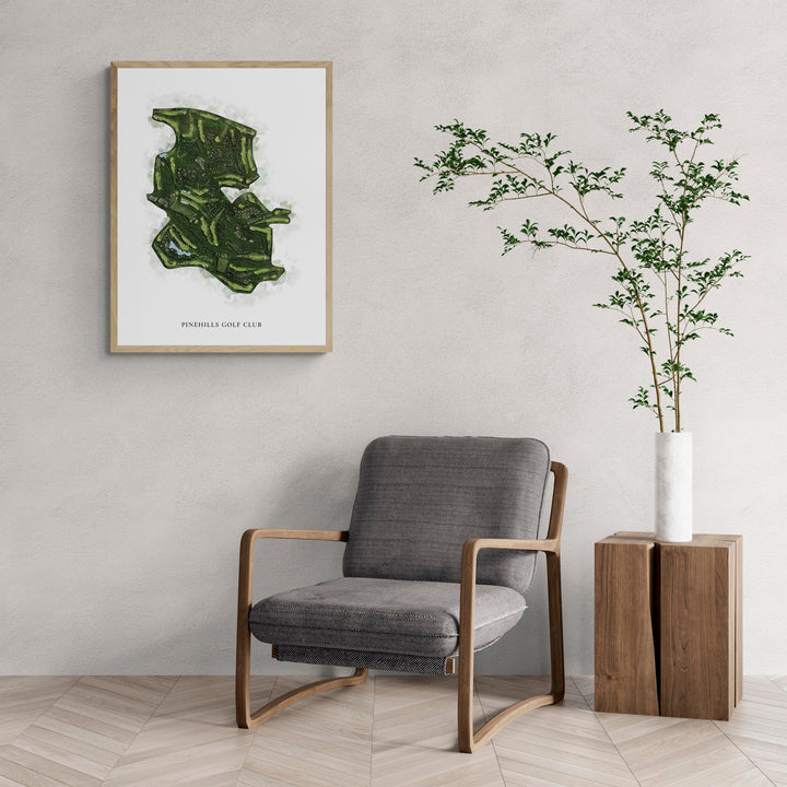 Classic Map of Pinehills Golf Club with a comfy armchair and large plant