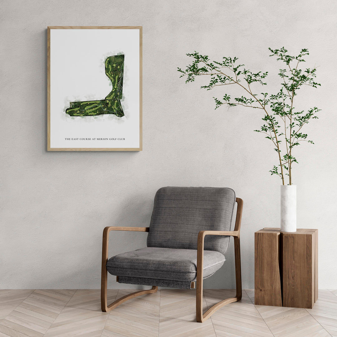 Classic Map of The East Course At Merion Golf Club with a comfy armchair and large plant